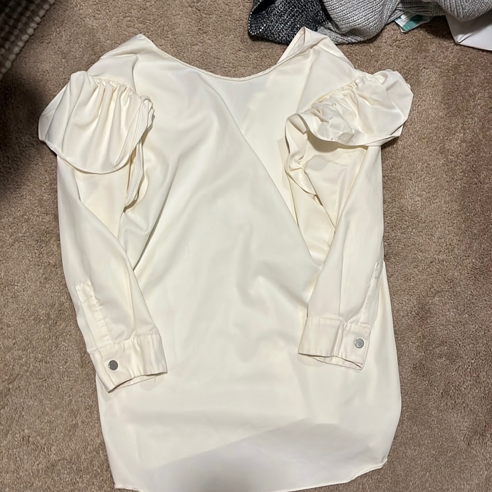 White ruffle shirt